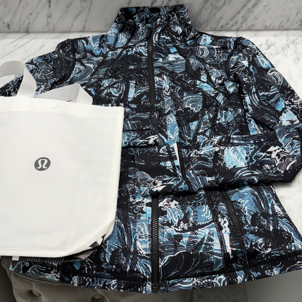 lululemon define full zip, size 2. Light weight with stretch.  Hardly worn.